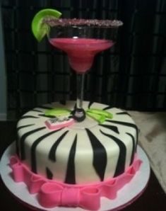 a cake decorated with zebra stripes and a martini