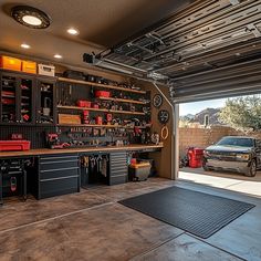 a garage with lots of tools in it and a truck parked outside the garage door