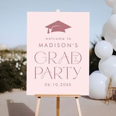 a welcome sign with balloons in the background for a graduation party or bridal party