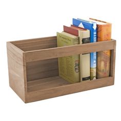 a wooden book shelf with books in it