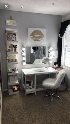 a bedroom with a desk, mirror and shelves on the wall in front of it