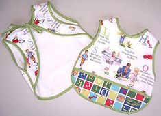 two bibs with pictures of people on them, one is green and the other is white