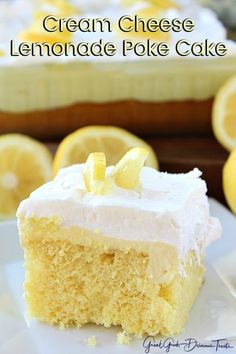 a close up of a piece of cake on a plate with lemons in the background