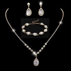 Elevate your elegance with this exquisite 14K  3-piece gold jewelry set, featuring a matching necklace, earrings, and bracelet adorned with dazzling cubic zirconia insets. Each piece is designed to radiate timeless sophistication, making it the perfect accessory for weddings, formal events, or a glamorous night out. Crafted with hypoallergenic materials, this set is gentle on sensitive skin, ensuring all-day comfort. Waterproof and tarnish-free, it's designed to retain its brilliant shine no mat Multiple Piercings Earrings, Citrine Crystal Necklace, Indian Diamond Jewellery, Gold Jewelry Set, Flower Girl Bracelets, Bridal Necklace Set, Gold Jewelry Sets, Cultured Pearl Necklace, Hypoallergenic Jewelry