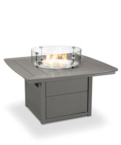 an outdoor table with a fire pit on top