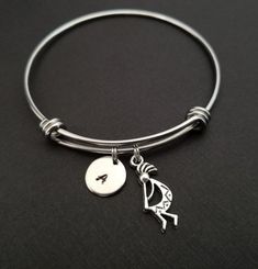 Personalized Antique Silver Kokopelli Bangle Bracelet!  A detailed kokopelli charm on an expandable bangle bracelet makes the perfect gift for you or your best friend.The kokopelli bracelet charm is made from zinc alloy and measures 24 mm by 10 mm.  The bangle bracelet is high quality stainless steel and fits a wrist sized 6-8".  The kokopelli bangle bracelet is personalized with a .5" silver plated disc stamped with the initial of your choice.  The charm and initial disc are connected to the ba Symbolic Adjustable Nickel-free Charm Bracelet, Adjustable Southwestern Bracelets As Gift, Symbolic Round Adjustable Cuff Bracelet, Southwestern Adjustable Nickel Free Bracelets, Adjustable Southwestern Style Bracelets As Gift, Adjustable Southwestern Style Bracelets For Gifts, Southwestern Style Round Bracelets As Gifts, Chef Necklace, Fox Jewelry