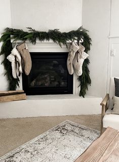 a living room with a fireplace decorated for christmas