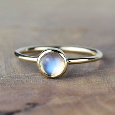 A beautiful fine moonstone stacking ring made from solid 9ct yellow gold. The moonstone is of a very fine quality and is simply stunning when set in gold. Moonstone is the birthstone of June and glistens with flashes of blues, greens and purples. You can choose to wear the ring on its own, or mix and match it with other stacking rings from our shop. Handmade in our Orkney Islands workshop, right at the top of Scotland, each piece arrives in a branded Alison Moore Designs box. In orders over £100 Orkney Islands, Gold Stacking Ring, Tarnished Jewelry, Horses Pendant, Gold Ring Stack, Stackable Ring, Polish Jewelry, Stacking Ring, Jewellery Boxes