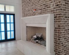 an empty fireplace in the middle of a room