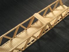 a wooden bridge is shown on the floor