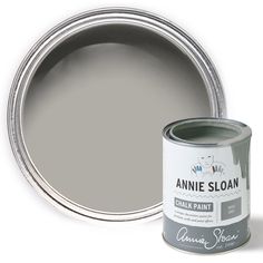 a can of annie sloan chalk paint next to it's open tint on a white background