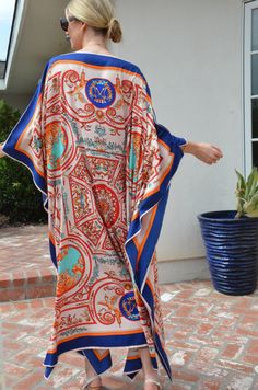 Feel like a queen in this elegant, sumptuous, silk caftan with its intricate design. The soft, smooth, luxurious silk fabric is not sheer and does not require a slip. A beautiful way to dress at the pool or beach or a perfect way to be beautiful at a resort or on a cruise. Not on vacation? Just enjoy this gorgeous caftan lounging or entertaining at home. One size. It can be worn by many sizes, small to X_large. The width is 52 inches edge to edge or 104 inches around the body. The side seams are Elegant Multicolor Kaftan For Vacation, Elegant Multicolor Kaftan With Kimono Sleeves, Elegant Maxi Length Kimono For Festivals, Elegant Maxi Length Festival Kimono, Elegant Printed Kaftan For Beach Cover-up, Elegant Printed Silk Kaftan, Elegant Silk Printed Kaftan, Elegant Multicolor Tunic Kaftan, Elegant Multicolor Maxi Length Kaftan