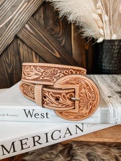 A full tooled leather belt with matching leather buckle. A statement to any outfit. 100% Leather Belt Width: 1.5" Small 32" | 30"-34" Medium 36" | 34" - 38" Large 40" | 38" - 42" **All measurements are taken from top of the belt to the first and then to the last hole** Buckle can be removed Adjustable Hand-tooled Leather Belt, Hand Tooled Leather Belts For Western-themed Events, Leather Embroidered Belt For Western-themed Events, Embroidered Leather Belt For Western-themed Events, Leather Belt With Embroidery For Western-themed Events, Hand Tooled Leather Belt Buckles For Rodeo, Adjustable Hand-tooled Belts, Hand Tooled Leather Belt Buckles For Ranch, Adjustable Hand Tooled Belts For Rodeo