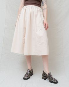 [she loved the sound of summer rain tapping against her window]Meet Emma, the embodiment of effortless style! This handmade full skirt radiates cozy minimalist chic vibes. Its stretchy elastic waist ensures unrestricted comfort, making it perfect for any day of the month. Crafted from stunning, thick linen fabric, Emma offers a luxurious feel you'll simply adore. Dress it up with boots and a blouse for a date, or keep it casual with sneakers and a tee for running errands. Heading to the office? Spring A-line Bottoms With Elastic Waistband, Flowy A-line Summer Bottoms, Feminine Pleated Waist Bottoms For Summer, Summer Feminine Bottoms With Pleated Waist, Feminine Bottoms With Pleated Waist For Summer, Feminine Summer Bottoms With Pleated Waist, Cotton Midi Length Bottoms For Summer, A-line Cotton Bottoms For Summer, Summer A-line Stretch Bottoms