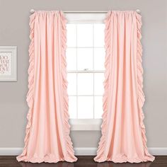 pink curtains with ruffled edges in front of a white wall and wooden flooring