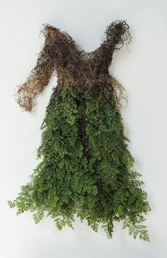 a dress made out of branches and moss