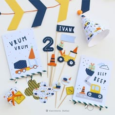 construction themed birthday party supplies including cupcake toppers, straws and napkins