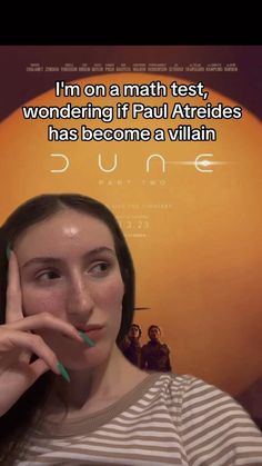 a woman holding her hand to her face in front of an orange background with the words, i'm on a math test, wondering if paul articles has become a villain