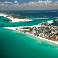 an aerial view of the beach and ocean in miami, florida with buildings on both sides