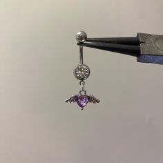 Purple Heart + Silver Angel Wings belly bar 💜 Uk postage is £1 1st class postage is £2  International postage is available 💌 Belly Piercing Jewelry, Silver Angel Wings, Belly Bars, Body Jewelry Piercing, Belly Piercing, Belly Button Piercing, Purple Heart, Funky Jewelry, Belly Rings