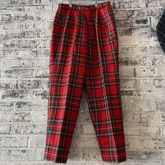 "These fun red, plaid pants are perfect for the holidays! Look festive AND stay warm in 100% wool, with a soft, silky lining to prevent the itch! Tag says 70-72-74 Measurements: 13.5\" across the waist  18.5\" through the hip 38\" top to bottom 27\" inseam  7\" bottom cuff" Classic Plaid Pants For Fall, Casual Red Holiday Bottoms, Fitted Holiday Bottoms For Fall, Casual Red Bottoms For Holidays, Fitted Bottoms For Fall Holiday, Scottish Style Plaid Winter Bottoms, Red Scottish Style Fitted Bottoms, Red Tartan Fitted Bottoms, Classic Plaid Bottoms For Winter