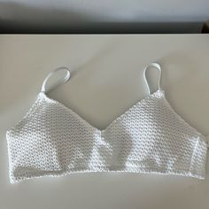 Adjustable Straps Adjustable Back Crochet Outside Lining Removable Cups White Seamless Crochet Top For Summer, White Open Knit Crop Top For Beach, White Seamless Crop Top For Vacation, White Crochet Trim Triangle Top, White Crochet Lace Triangle Top, Casual Stretch Bra For Beach, White Seamless Bra For Beach, White Seamless Beach Bra, White Triangle Top Bra For Vacation