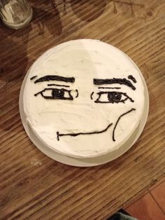 a cake with a face drawn on it