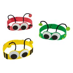 three bracelets with googly eyes are shown in three different colors and shapes, one is green, the other is red