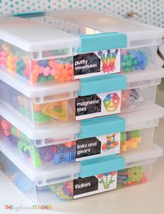 plastic storage containers filled with colorful beads and magnets