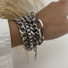 Super chunky 4 strands mixed styles and sizes steel chain bracelet that looks amazing as well with chic or casual outfits.  ADD approximately 1 - 1.25 inch to your wrist size to SELECT A SIZE  MATERIAL * Stainless steel (hypoallergenic, waterproof and won't change color). On pictures, 6.5 inches wrist showing 8 to 8.5 bracelet attached at 8 inches (it is a little too loose). You will receive this beautiful bracelet in a box decorated with bow. Similar bracelet; https://www.etsy.com/ca-fr/listing Trendy Metal Cuban Link Bracelet With Chunky Chain, Trendy Cuban Link Bracelet With Chunky Chain, Trendy Stainless Steel Chunky Chain Bracelet, Trendy Chunky Stainless Steel Jewelry, Chunky Silver Bracelet, Silver Bracelet Stack, Silver Bracelet For Women, Gothic Bracelet, Layered Choker Necklace