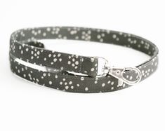 This charcoal gray polka dot lanyard offers a great way to wear your ID badge or keep track of your keys this season. Fabric is a dark gray background with scattered cream dots, as shown. Make it a breakaway lanyard by purchasing the breakaway clasp option here: https://etsy.me/3goR8VJ Made from 4 layers of high quality cotton fabric, my lanyards combine flexibility with durability. They are constructed to be comfortable enough to wear around your neck all day. This lanyard measures approximatel Dark Gray Background, Fabric Lanyard, Dark Grey Background, Teacher Lanyard, Lanyard Keychain, Key Lanyard, Id Badge Holders, Clear Vinyl, Id Badge