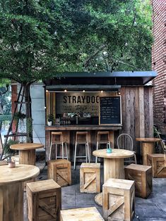 tables and stools are arranged in front of a stand with a sign that says stravoc on it