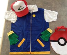 a pokemon costume and hat are laying on the floor