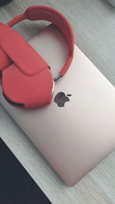 an apple laptop with a red headband attached to it