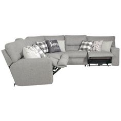 a large sectional couch with pillows on it