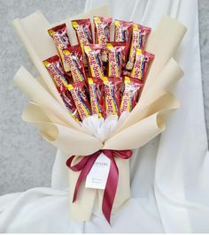 a bouquet of candy wrapped in white paper