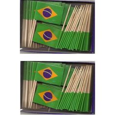 two boxes filled with matches and flags next to each other