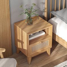 a small wooden table with a plant on it in front of a bed and nightstand