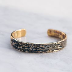 Brass Abstract Band Bracelet that is slightly adjustable. Available in women's and men's lengths. A rustic gold cuff bracelet style adds the perfect touch dressed up or down. Bracelet Size Medium (Women's) Large (Men's) Available in 925 Sterling Silver https://etsy.me/3i4Htje A note about brass jewelry and oxidization: Verdigris is the common name for a green coloring obtained through the application of acetic acid to copper plates or the natural patina formed when copper, brass or bronze is wea Adjustable Gold Band Cuff Bracelet, Adjustable Hammered Bronze Bracelets, Gold Cuff Bracelet With Adjustable Band As Gift, Gold Band Bracelet, Gold Pendants For Men, Copper Plates, Chain Link Necklace Silver, Mens Pinky Ring, Gold Cuff Bracelet