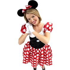 a woman dressed in minnie mouse costume posing for the camera with her hands on her face