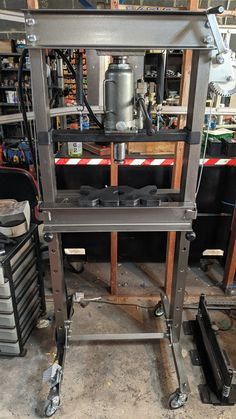 a metal work bench in a garage with tools on it