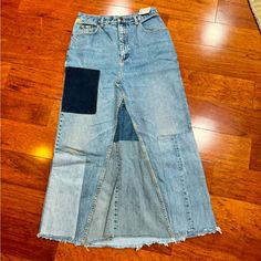 a pair of jeans with different colored patches on them