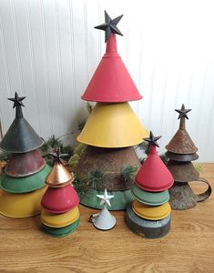 small christmas trees made out of old tin canisters