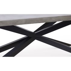 a concrete table with black metal legs and an x design on the top, against a white background