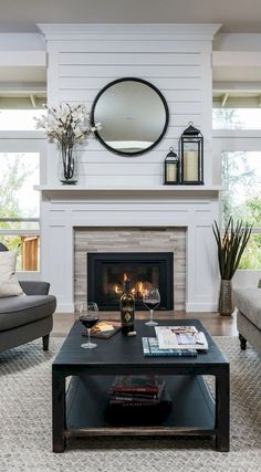 the living room is clean and ready for us to use it's fireplace as a focal point