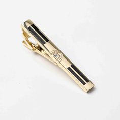 TIE CLIP "SIGNATURE" – Pisani Maura Classic Black Lapel Pin For Formal Occasions, Classic Gold Suit And Tie Accessories For Black Tie, Classic Gold Suit And Tie Accessories For Formal Events, Classic Gold Suit And Tie Accessories For Formal Occasions, Elegant Gold Rectangular Suit And Tie Accessories, Elegant Gold Jewelry For Black Tie Event, Elegant Gold Jewelry For Black Tie, Classic Gold Suit And Tie Accessories, Black Jewel