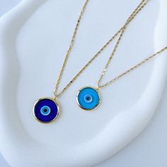 The Evil Eye necklace, also known as the Nazar or mal de ojo, is a symbol of protection against negative energies and harmful intentions. This ancient talisman is believed to watch over and shield the wearer from envious or malevolent glances, keeping them safe and ensuring good luck. Carry the protection and positive vibes of the Evil Eye with you wherever you go, and let it be a constant reminder of your resilience and the beauty that surrounds you. An evil eye necklace serves as a unique and meaningful choice for Mother's Day, Valentine's Day, or New Year's gift, offering protection and style in one. -Gold plated over brass charms.  All items are shipped worldwide with tracking number.  Our packages come with a gift-ready box. ✨You will recieve 1 necklace. ❖ Size ❖ Length: 40 cm + 3 cm Emotional Gifts, Evil Eye Choker, Symbole Protection, Blue Evil Eye, Brass Charms, Necklace Blue, Evil Eye Necklace, Good Fortune, Nouvel An