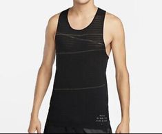 Elevate your running gear with this Nike Dri-FIT ADV Pinnacle AeroSwift Running Singlet for Men. This sleeveless tank features a round neckline and a pullover closure for a comfortable fit. The slim fit of this activewear top is made with a lightweight and breathable blended fabric, perfect for summer, fall, and spring seasons. The black solid pattern is accented with a Nike logo and reflective details for safety during low-light runs. This Nike Dri-FIT tank is machine washable with a light fabric wash for easy maintenance. Ideal for gym and training, track and field, walking, weightlifting, bodybuilding, cross training, CrossFit, racing, and running and jogging. Singlet For Men, Spring Workout, Running Singlet, Nike Branding, Men's Activewear, Nike Tank, Nike Tank Tops, Track Field, Gym Training