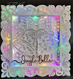 a white paper cutout with the word angel bell on it