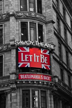 an old building with a sign that says let it be on the front and side